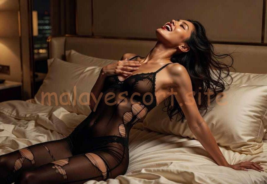 Woman in black lingerie on a bed