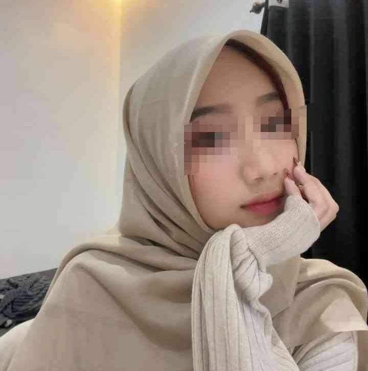 Young Malay woman in hijab, KL escort